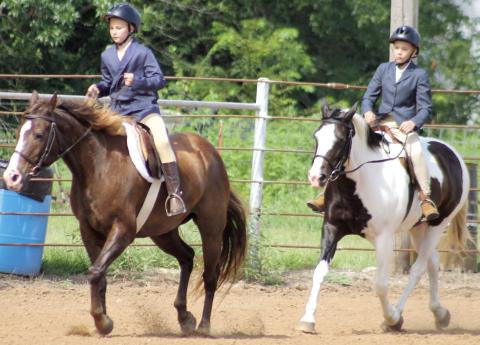 Elizabeth King and Samuel King members of Heritage Youth Association participated in the Hunt Seat Under Saddle class at the Cherokee County pre-fair horse show Saturday, July 11.