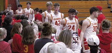 Players and parents of the Columbus Recreation Mini Basketball Teams welcomed the Titans back to the court following the introduction of the boys teams at the halftime break of the varsity game.