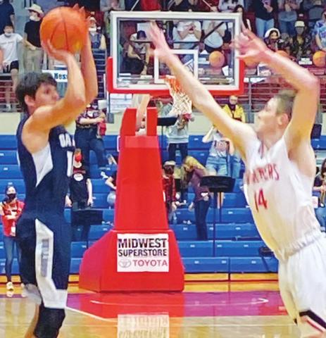Galena Bulldog Junior, Brett Sarwinski, shoots for three points over a Hesston Swather in the Kansas Class 3A State Championship game, Saturday in Hutchinson. Sarwinski led all scoring with 19 points in the 45-36, Galena loss. Courtesy Photo.