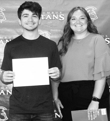 Kyler Baylor received a $1,000 Academic Achievement Scholarship from Pittsburg State University during the May 20 Senior Awards Assembly at the CUHS Gymnasium. Anna Farrow, PSU representative presented multiple scholarships to Columbus High School students.