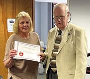 A Challenge Award was presented to Southeast Elementary School Principal Tammie Hall by Kansas State Board of Education member Jim Porter. Courtesy photo.