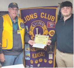 Carter Henry was presented his Lion of the Month certificate by Columbus Lions Club President Brad Gleason. Courtesy photo.
