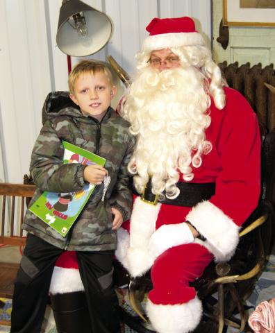 During the Columbus Museum open house Santa arrived to visit with the kiddies. Braden Pease talked to Santa about the upcoming holiday and explained how he was a good boy all year.