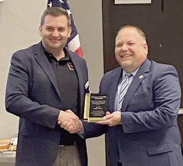 KSRA President Travis Couture-Lovelady presenting the Kent Radcliff Memorial Law Enforcement Award to Cherokee County Sheriff David Groves. Courtesy photo.