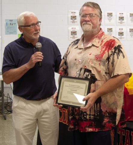 Dr. Brian Smith recognized Buddy Derfelt for 25 years of teaching.