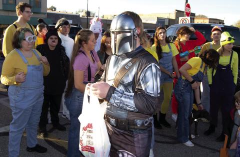 Dressed as Mandalorian, this trick or treater passed by the Columbus High School Band booth during the Trick or Trunk held Monday on the Square. Many of the band members dressed as Minions for the occasion.