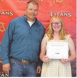 Senior, Gracie Hall, received the Ford FFA Scholarship in the amount of $1,000 during the May 15 Columbus Unified High School Senior Assembly from CUHS FFA Sponsor, KC Youngblood.