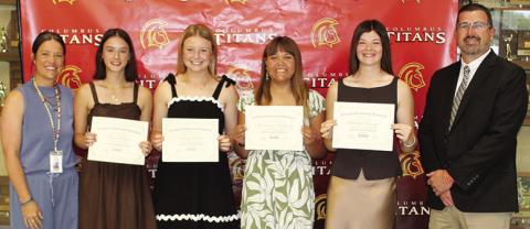 Four Columbus Unified High School Seniors received the Maureen H. Paulsen Memorial Scholarship during the 2026 Senior Assembly, May 15, at the CUHS Gymnasium. Piper Hayes, Trinity Green, Mackenzie Richards, and Katelyn Draeger each received a $1,000 scholarship from CACF Board Member, Kelly Walters and USD 493 Superintendent Dan Grundy.