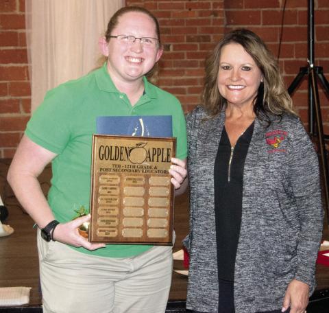 The Post-Secondary Golden Apple award was presented to Band Teacher Christine Lovell by Chamber Education Committee Chairperson Kari Soper.