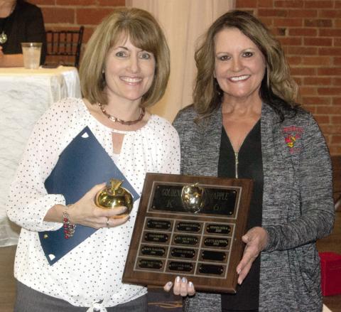 The Elementary Golden Apple award was presented to Kindergarten teacher Suzette Henderson, by Kari Soper at the Columbus Chamber banquet Wednesday evening.