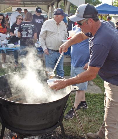 The 89th annual Weir Homecoming has become famous for their large pots of chili and beans served free to the public. The chili and beans have been served free to the public for more than 50 of those years. Stirring the pot David Jenkins served more than 150 servings to an appreciative audience.