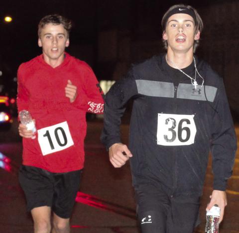 The annual Titan Band and Team Threads Zombie 5K was held Saturday. Derek Krause, number 36, was Overall first place male and he placed first in the 19 and under boys division. Levi Simpson, number 10 placed second in both categories. Whitney Osborn, not pictured, was the overall women’s winner.