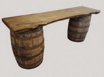 In its most basic form, a saloon might be created with a wooden plank resting atop two barrels in a tent. Courtesy Kansas Historical Society.