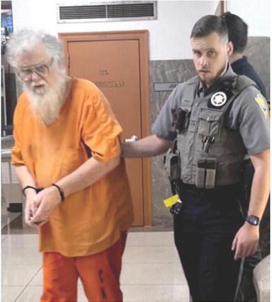 Cherokee County Deputy Alex Duckett escorts convicted sex offender John Clark from the courtroom Wednesday after Clark received four life sentences in the Kansas Department of Corrections. Courtesy photo.