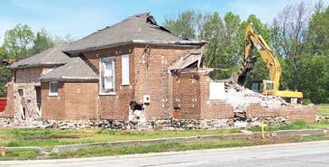 The Crestline Community Center is no more as it was razed by wreckers last week. The building had been a school, when the school closed it became a community center and continued to be a meeting place in the community for over 100 years. Photo by Danny O’Hara.
