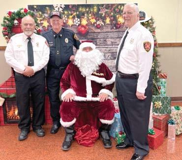 Les Page (right) was recognized for his 50 years of service in the Baxter Springs Fire Department. He joins Wayne Cook (center) in the 50 years club. Art Mallory has 48 years and will be joining them shortly.