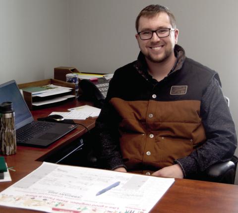 Cherokee County Ag and Natural Resource Agent Clayton Jester sits behind his desk at the K-State Research and Extension office in Columbus.