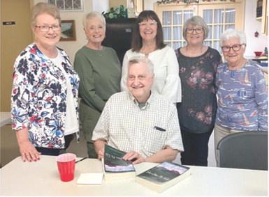 Author and former Columbus resident William Stoskopf is surrounded readers’ group members Lorna Stover, Dora Dunlap, Jane Rhinehart, Mary Torcia and Peggy LaCoste. Courtesy photo.