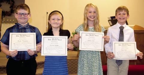 Bruce Thompson, Amillia Hudson, Haddon Hall and Gus Hall were all recognized at the recent Life Christian awards ceremony. Each youngster memorized 90 Bible verses.