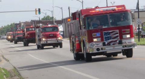 Early Saturday morning the Baxter Springs Fire Trucks formed a parade and moved down Military Avenue to their new home.