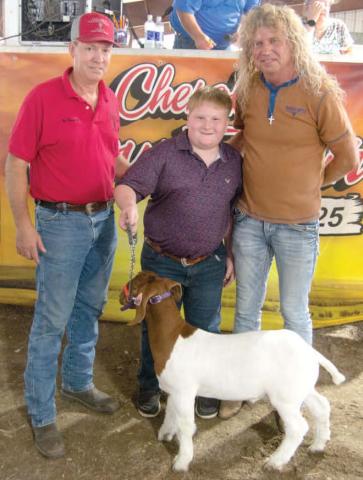 Easton Haywood, son of Kyle and Megan Haywood received a $3,000 premium bid from Draeger Farms after showing his Grand Champion Market Goat. Easton is a member of the Lone Elm Beavers 4-H Club.