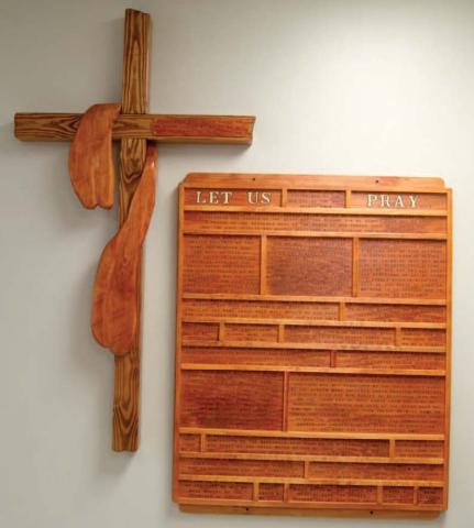 This woodwork wall hanging was made by Brad Gleason, father of Matthew and hangs in the St. Rose Parish Hall in Columbus. Gleason’s artwork was brought to the church earlier this year. “Apart from the Cross there is no other ladder by which we may get to Heaven,” a quote from St. Rose of Lima is on the cross.