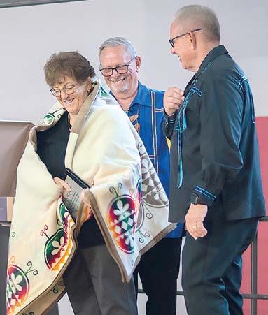 Columbus resident Kelly Carpino was awarded the tribe’s Honored Person award at the Wyandotte Nation of Oklahoma Annual Meeting recently. Presenting the award was tribe Chief Billy Friend and Second Chief Norman Hilderbrand. Photo courtesy William Swaim-Wyandotte Nation,