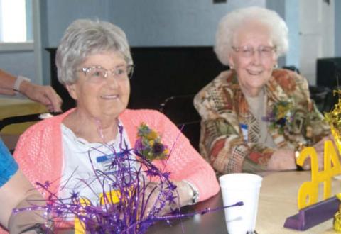 The Mineral All-School Reunion was well attended Saturday evening at the Old Parita Ballroom in Carona. JoAnne Sheidler and Virgina Robinson Moore, the oldest grad attending, visit before dinner.