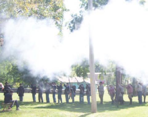 A large group of reenactors lined on the battlefield Sunday during the re-inactment.