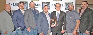 The Cherokee County Farmers Coop was recognized by the Department of Commerce as the Southeast Kansas Agribusiness Regional Award winner. Accepting the award were Paul Evans, Deven Foster, Jeff Karsten, Manager Matt Case, Lt. Governor David Towland, Josh Green and Tison Culley. Courtesy photo.