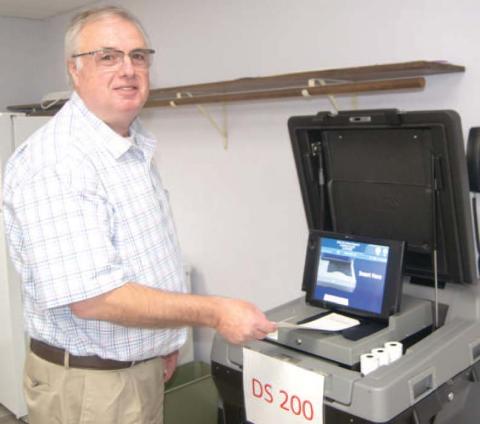 Casting his vote Doug Hall was voting at the Extension Office on Tuesday afternoon. The turnout was light with 1,874 votes out of 15,601 registered.
