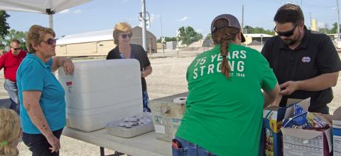 Columbus Chamber members sack up burgers, chips, water and condiments to be taken to the fields to Feed the Farmers. Working were Chamber Executive Director Jean Pritchett, Josie Welch, Spring Valley Leader and Matt Case, Manager of Farmer Co-op. Jeanette Crain was making the deliveries.