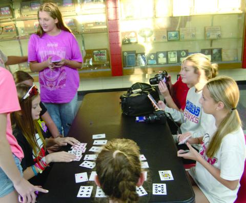 Recently Columbus Fellowship of Christian Athletes hosted other area FCA groups at an activity night. Students played a variety of games including cards (above) and also had food and drinks (below). There was also a special speaker for the event.