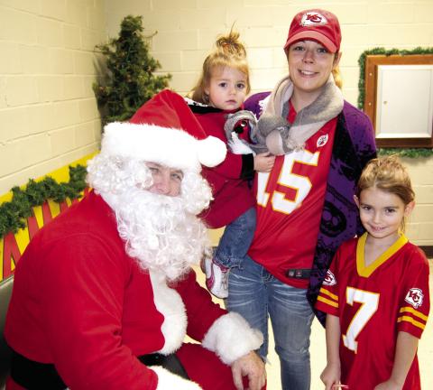 After the Scammon Christmas parade, Santa made a stop to visit with the children. Hazel Kimmnon, Kaya Kimmon and Raci Kimmon took some time to chat with him.
