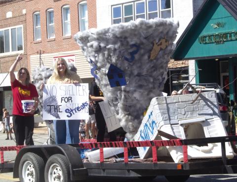 Above the senior class float proclaims “No shelter for the streaks”. Below the junior class float sported a football field themed creation. The Titans played Neodesha for their homecoming game.