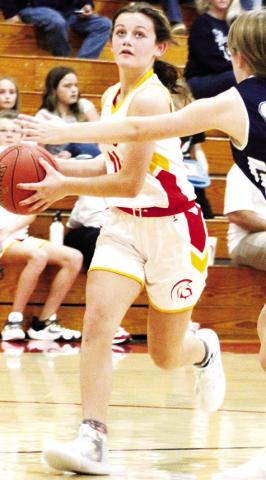 Lady Titan Seventh Grader, Americus Woodcock, drives past the Galena defender on her way to a basket in the CJHS 33-8, win over the Lady Bulldogs in the 7A game, Tuesday, at the CUHS Gym.