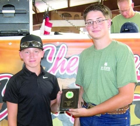 Brayden Green was presented the award for Champion Broiler by Fair King Eli Pritchett.
