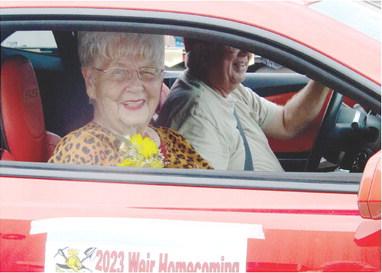 Weir Homecoming Parade Grand Marshal Karen Jeanette Sullivan waves to the crowd as she travels along the parade route during Saturday’s 88th annual parade.