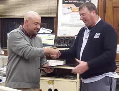 Columbus Post Master Tyler Speer presented long time postal carrier Patrick Billesbach with a certificate recognizing his years of service and celebrating his retirement. Billesbach has worked in Pittsburg as well as here in Columbus. Billesbach began as a mail clerk before taking a carrier position. Courtesy photo.