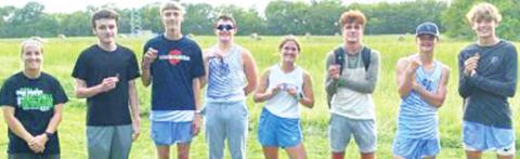 Members of the Lancer Cross Country Team medaling at Girard, Thursday, with Coach Laney Lawson are: junior, Logan Bois; junior, John Turpen; junior, Dakota Smith; junior, Audrey Jacobs; junior, Drake Guyman; freshman, Colton Jameson; and junior, Easton Renn. Courtesy Photo.