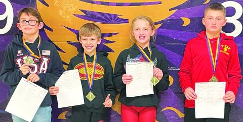The Columbus Wrestling Club had four Mini Titans participate in the Coffeyville Kids Wrestling Tournament over the weekend. All four wrestlers brought home first place medals in their respective age and weight classes and the team championship. William Weber took first place in the 12U, 76/80 class, Lucas Natalini won the 8U, 67-pound class, Raelee Engroff placed first in the girls 10U, 82/85 class, and Carlson Britt was the first place winner in the 12U, 88-92 class. Courtesy Photo.