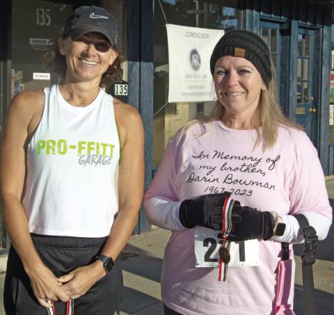 In the women’s age 50-59 division of the Columbus Day 5K, Missy Proffitt placed first with a time of 31:44. Laura Epler placed third with a time of 39:31. Not pictured, Karla Line placed second with a time of 32:45.