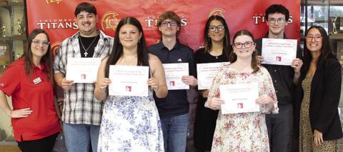 Five Columbus Unified High School Seniors received Tuition Scholarships from Labette Community College during the 2026 Senior Assembly, May 15, at the CUHS Gymnasium. LCC Representatives Elizabeth Kitterman and Mia Howard presented the scholarship certificates to Skyler Saporito, Gauge Buergin, Adalie Grafel, Broland Gibson,and Aubrie Wilson. Kemper Dobkins received a $300 LCC Cardinal Scholarship.