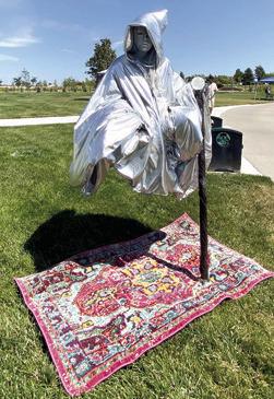 In addition to being a talented stilt walker, Erin Wilson, also known as Erin the Extraordinary is a master of illusion when it comes to her human statue portrayals. Check her out during Columbus Days. Courtesy photo.