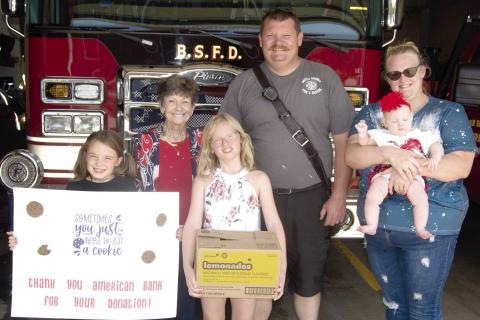 The Baxter Springs Girl Scouts received a helping hand from American Bank as the bank purchased several cases of Girl Scout Cookies which had gone unsold. The girls then delivered the cookies to the Baxter Springs Fire Department as a thank-you to the men and women in the department. American Bank vice-president Judy Hill was joined by Girl Scouts Kinley Capps and Sutton Russell as they presented the cookies to John Hunt with Baxter Fire Department.