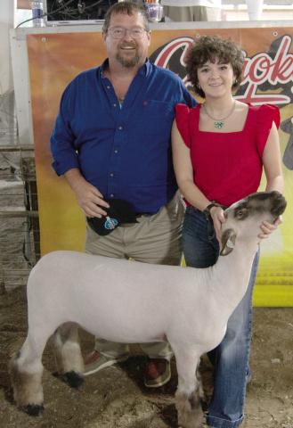 Heritage Youth of America member Emma Duling, daughter of Bill and Ragena Duling, showed her Grand Champion Market Sheep at the auction and received a $2,100 premium from Dr. Rob Herron Dental Clinics.