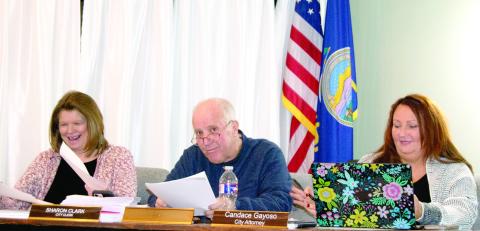 Newly sworn-in Mayor Kelly Abbott took his place at the end of Tuesday’s City Council meeting. He is between City Clerk Sharon Clark and City Attorney Candace Gayoso.