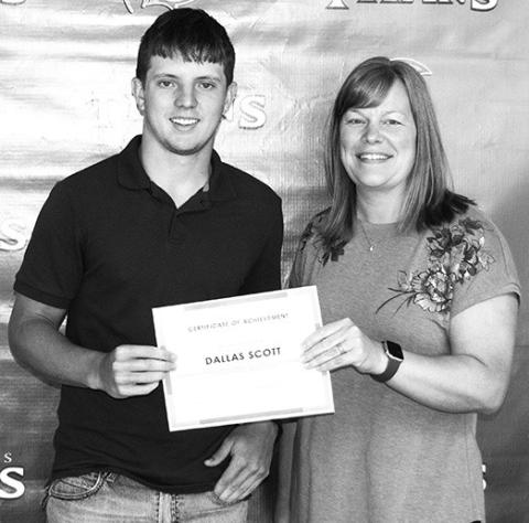 CUHS Senior Dallas Scott received a Crossland Kickstart Scholarship presented by Crossland representative Misty Spear at the Senior Awards Ceremony held May 17 at the Columbus Unified High School gymnasium.