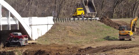 Cherokee County Road Department workers were busy last week clean debris from the area around the Rainbow Bridge outside Baxter Springs. When completed the cleaned area could become a picnic-grounds with tables.