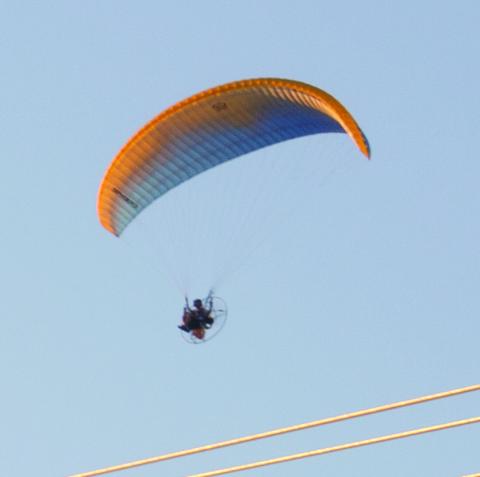 Several years ago seeing a powerchute in the skies over Columbus was not unusual, since they were manufactured here. However in today’s world they are seldom seen, Tuesday evening this powerchute was travelling south near Highway 7.